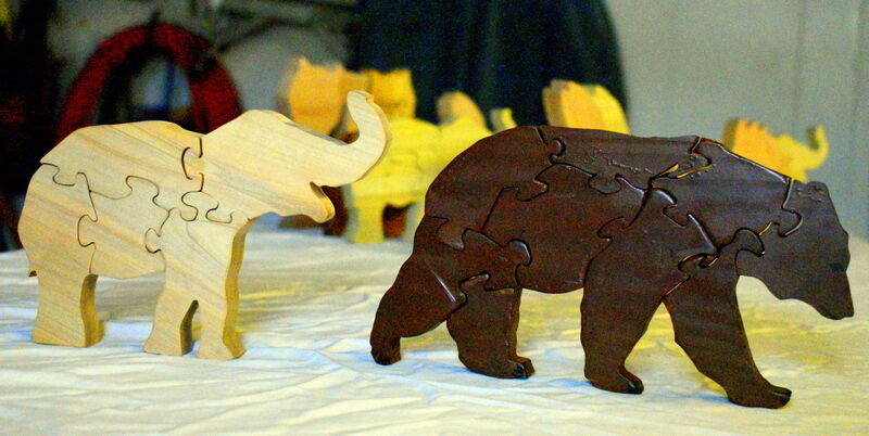 Santa’s woodworking helpers are busy making puzzles for needy children